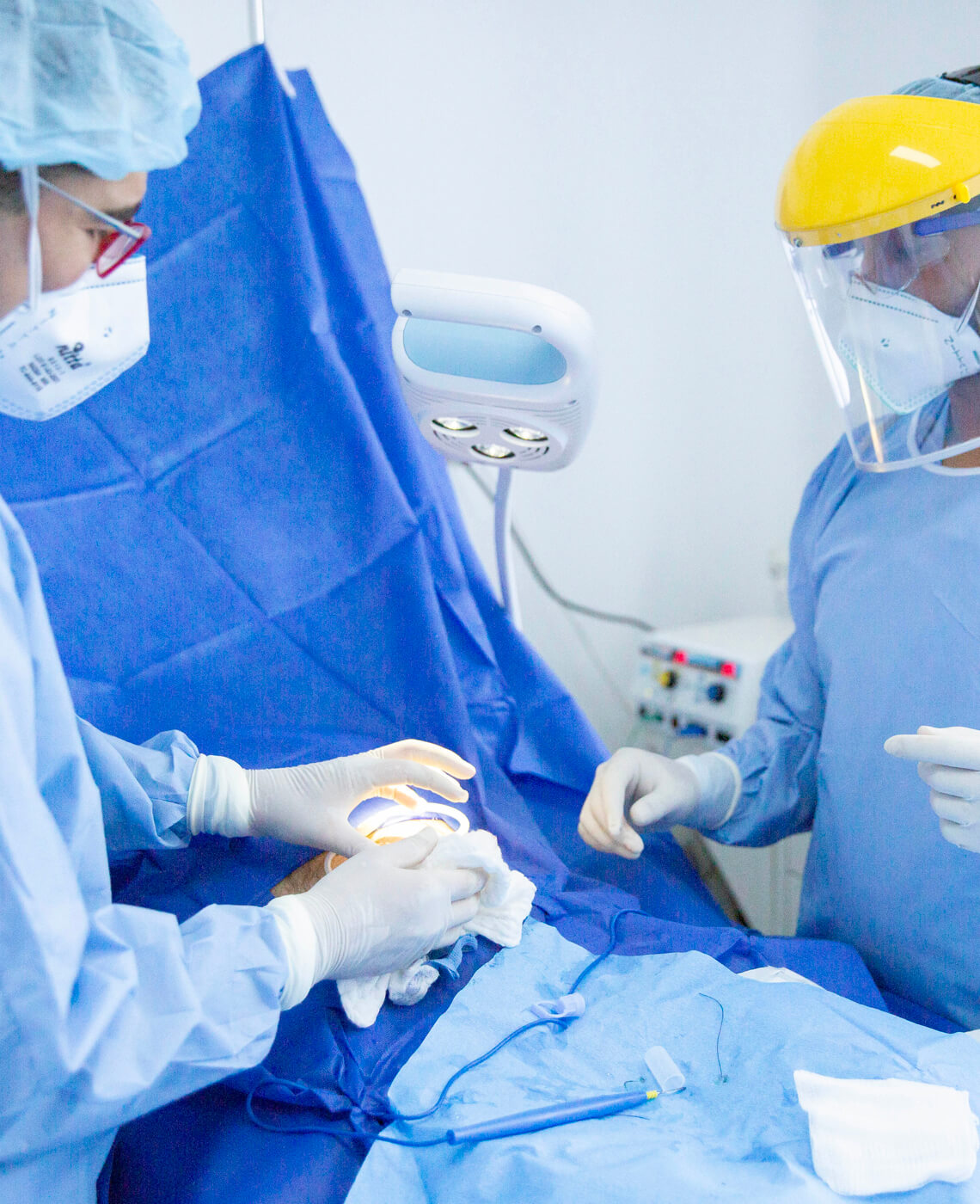 Doctors inserting a catheter